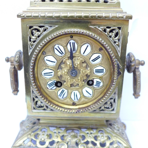 823 - A late 19th Century brass mantel clock, the Japy Freres movement striking on a bell and with cabacho... 