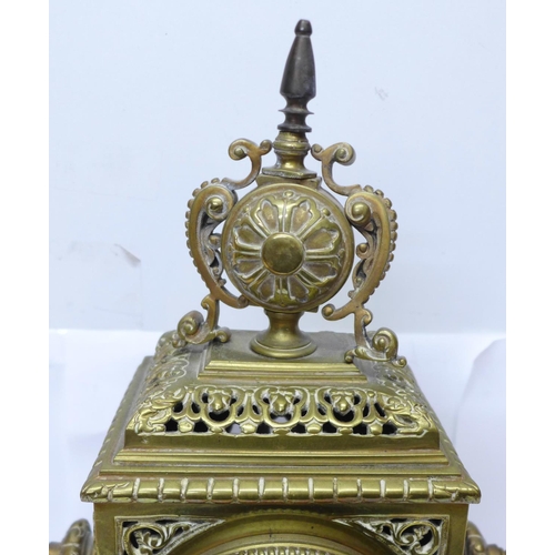 823 - A late 19th Century brass mantel clock, the Japy Freres movement striking on a bell and with cabacho... 