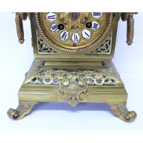 823 - A late 19th Century brass mantel clock, the Japy Freres movement striking on a bell and with cabacho... 