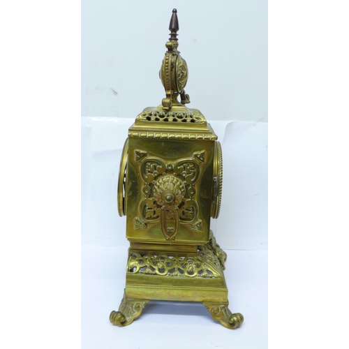 823 - A late 19th Century brass mantel clock, the Japy Freres movement striking on a bell and with cabacho... 