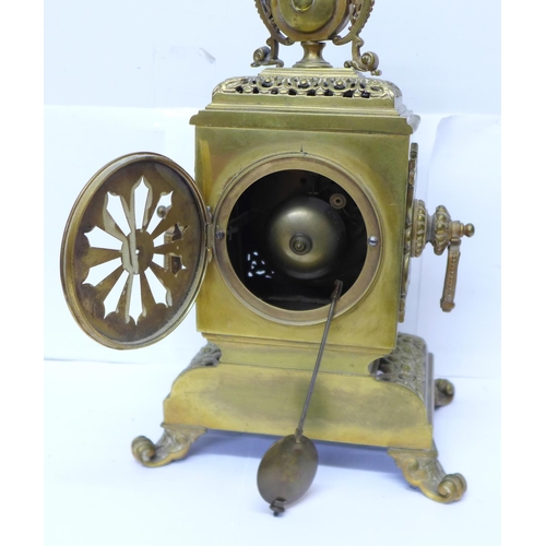 823 - A late 19th Century brass mantel clock, the Japy Freres movement striking on a bell and with cabacho... 