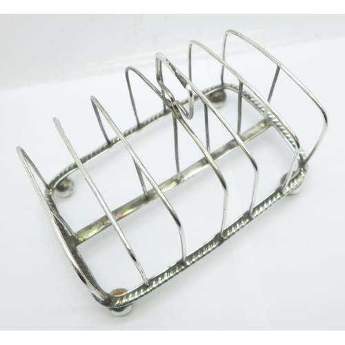 853 - A George III silver toast rack, London 1810, 205g