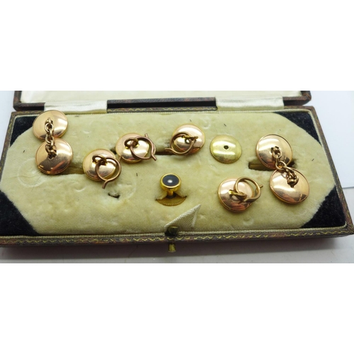 873 - A cased set of buttons and cufflinks