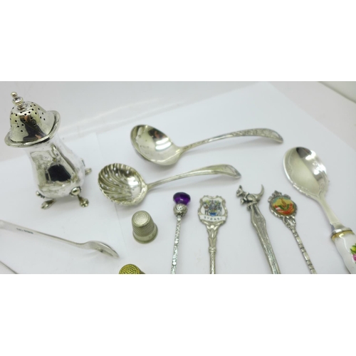 874 - A collection of silver, two pairs of sugar bows, pill box, mustard spoon, tooth pick, 137g and a col... 