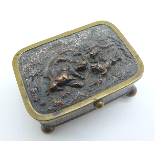 881 - A metal and silk lined jewellery casket with hunting scene on lid, mark FC on base, 6.5cm x 4.5cm