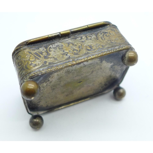 881 - A metal and silk lined jewellery casket with hunting scene on lid, mark FC on base, 6.5cm x 4.5cm