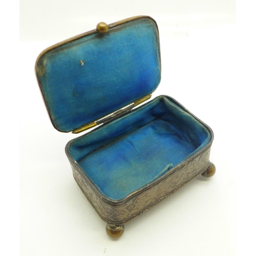 881 - A metal and silk lined jewellery casket with hunting scene on lid, mark FC on base, 6.5cm x 4.5cm