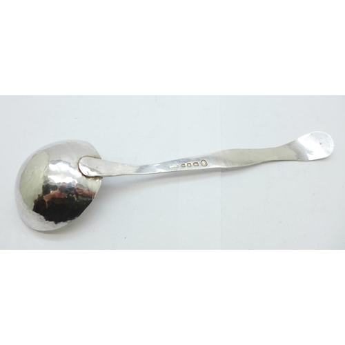 885 - A hammered silver ladle, London 1952, 33g