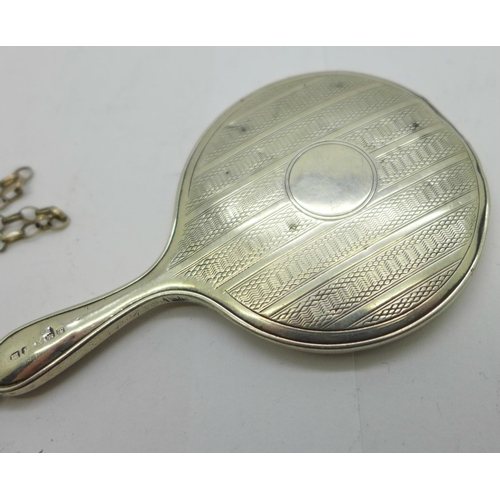 892 - A silver miniature hand mirror on a silver chain