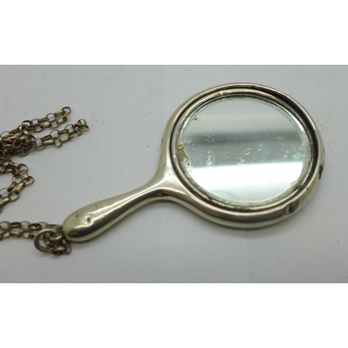 892 - A silver miniature hand mirror on a silver chain