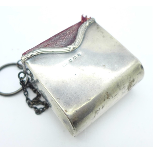 899 - A silver Prayer and Hymn Book holder, 44g with a miniature prayer and hymn book