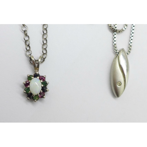 931 - Two silver pendants and chains, one set with opal and other gemstones