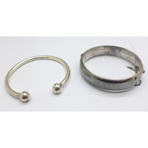 932 - Two silver bangles, 56g