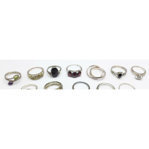 933 - Fifteen silver rings including one late Victorian buckle ring