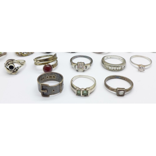 933 - Fifteen silver rings including one late Victorian buckle ring