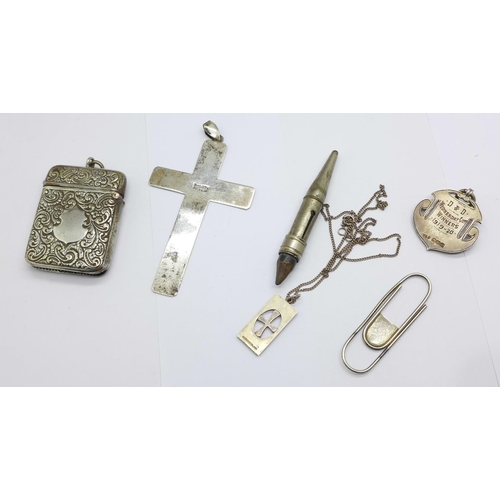 942 - A silver and enamel fob, a plated vesta case, a Finnish silver and gold fronted pendant and chain, a... 