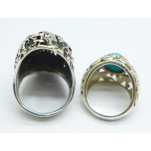 943 - Two silver rings, one 'zombie' and one set with a turquoise coloured stone, W and Q