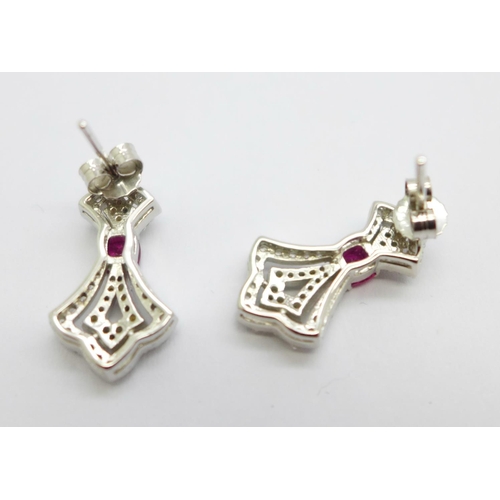 983 - A pair of silver gilt earrings set with ruby and diamond simulants