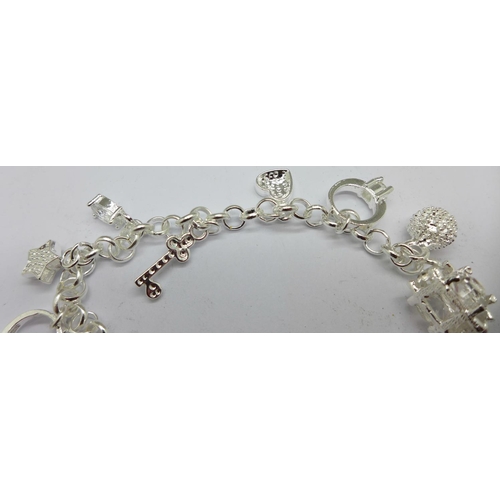 987 - A silver charm bracelet