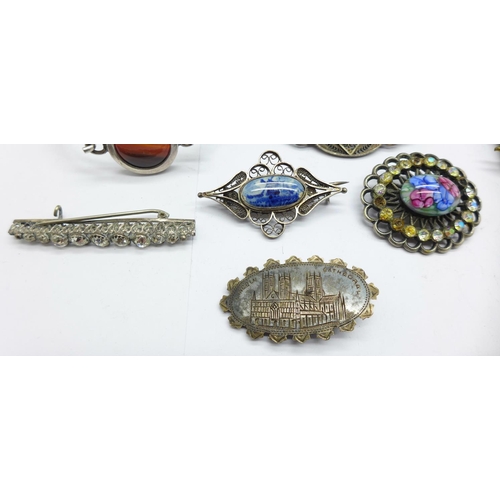 991 - A silver Lincoln Cathedral brooch, lacking pin, four other brooches, an agate set bangle, a vesta an... 