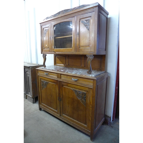 328 - An early 20th century French carved oak and marble topped buffet sideboard