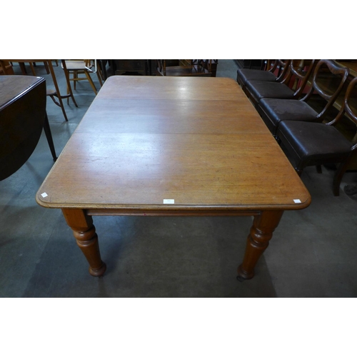 101 - A Victorian walnut dining table