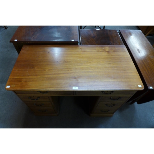 108 - A Victorian mahogany kneehole desk