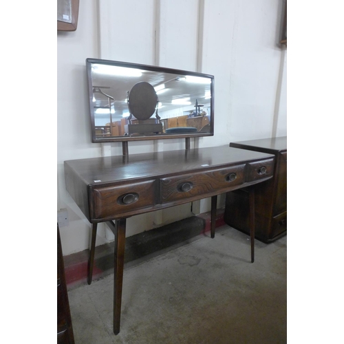 123 - An Ercol dark elm Windsor dressing table and stool