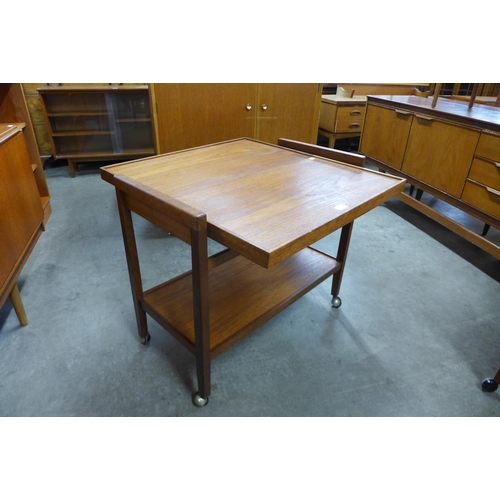 142 - A teak metamorphic tea trolley