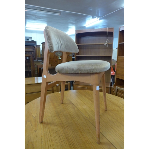 158 - A set of four teak dining chairs