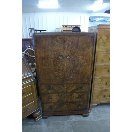 186 - An Art Deco figured walnut tallboy