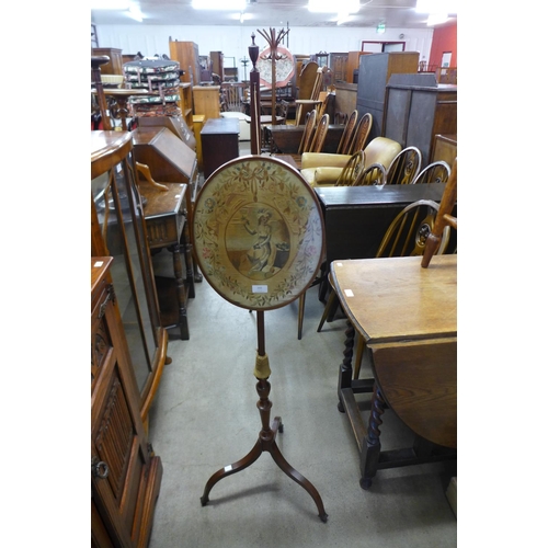 232 - A Victorian mahogany and silk embroidered pole screen