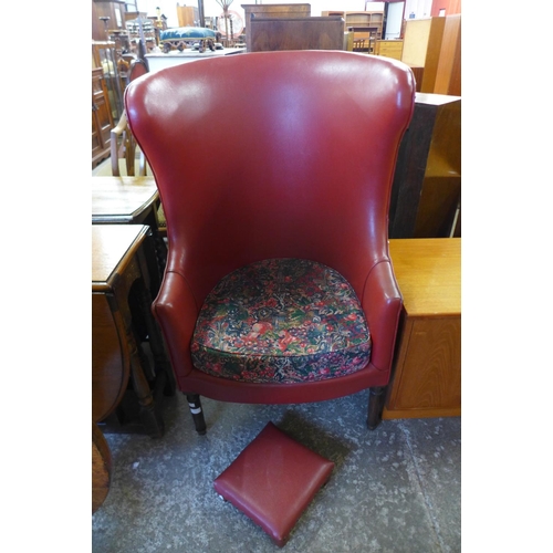 241 - A George III style mahogany and faux red leather armchair and footstool