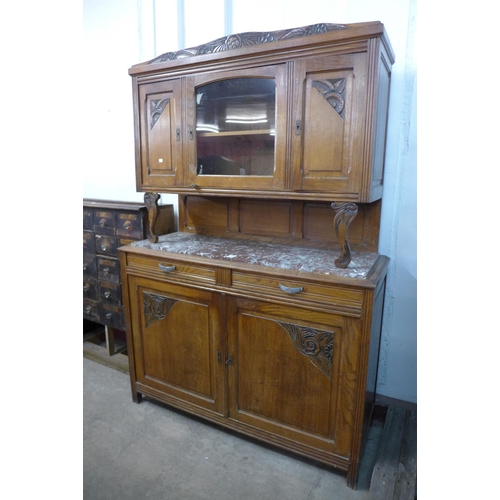 328 - An early 20th century French carved oak and marble topped buffet sideboard