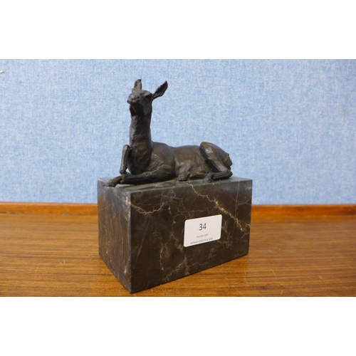 34 - A small bronze figure of a horse, on black marble socle