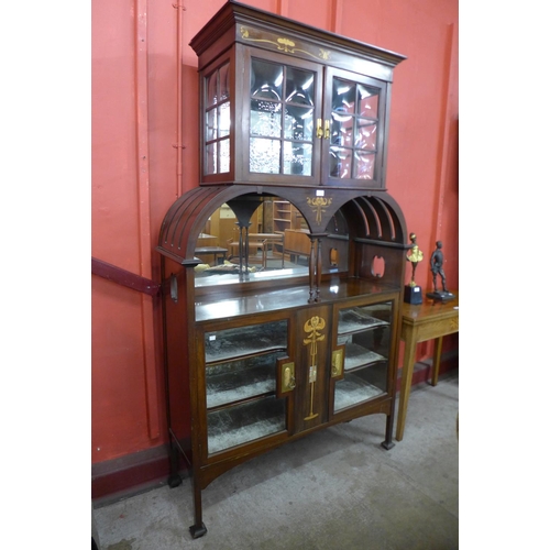 86 - An Arts and Crafts inlaid mahogany side cabinet