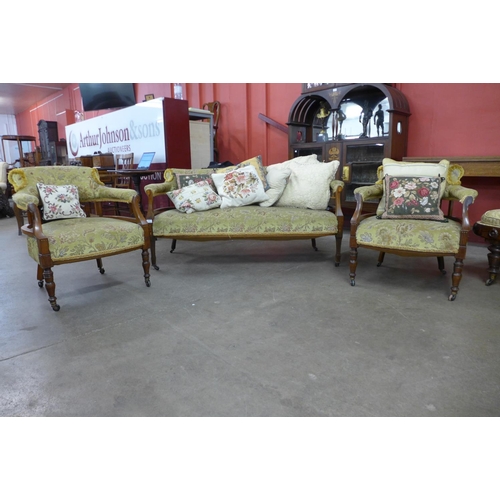 98 - A Victorian inlaid rosewood salon settee and pair of similar tub chairs