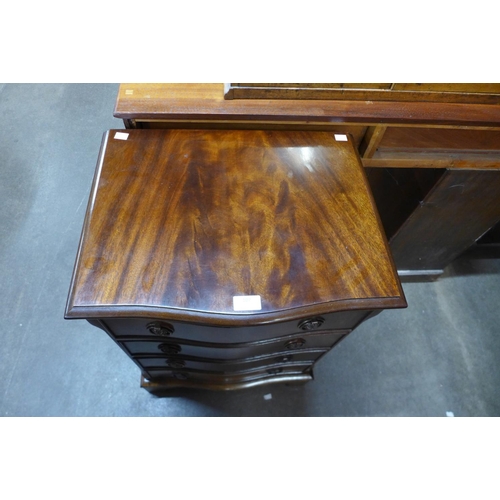 107 - A small mahogany serpentine chest of drawers