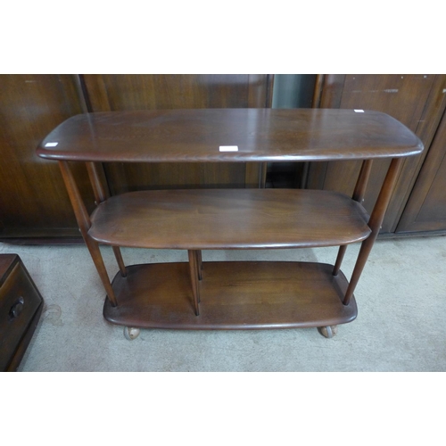 120 - An Ercol dark elm Windsor trolley