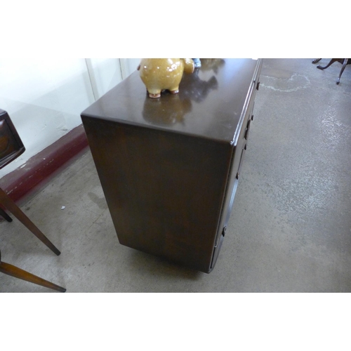 124 - An Ercol dark elm Windsor sideboard