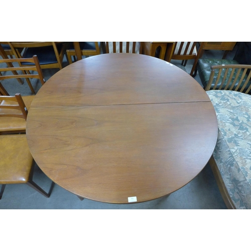 162 - A teak extending dining table