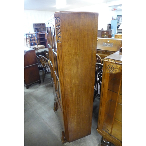 192 - A carved oak four door bookcase