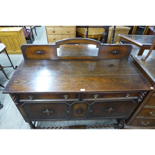 195 - An oak barleytwist mirrorback sideboard