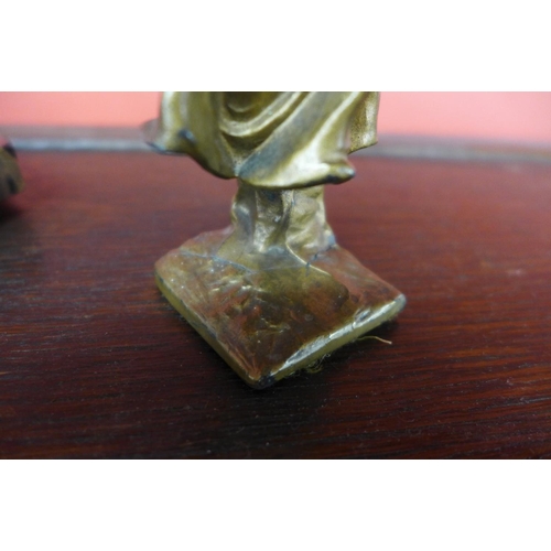 79 - An Art Deco marble inkwell and a faux ivory and gilt metal figure of a water carrier