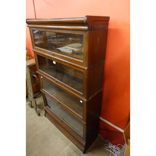 80 - A Globe Wernicke oak four tier sectional stacking bookcase