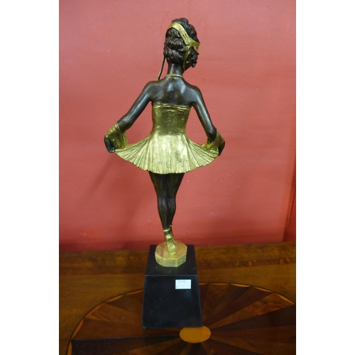 87 - An Art Deco style gilt bronze figure of a ballerina, on black marble socle