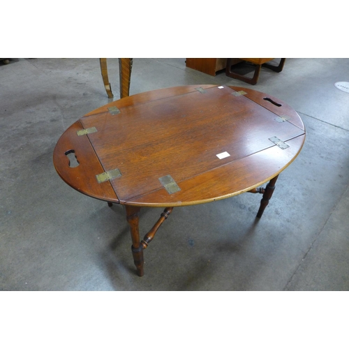 93 - A Victorian style mahogany butlers tray on stand