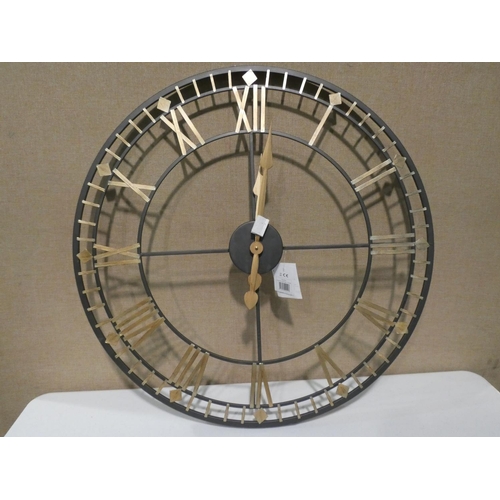 3075 - A black/gold metal circular clock (dia 80cm) * this lot is subject to VAT