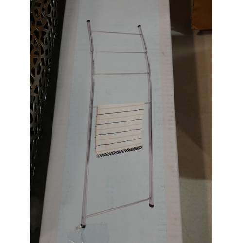 3162 - A loft towel ladder, a metal bath tray and a metal standing art (damaged) * this lot is subject to V... 