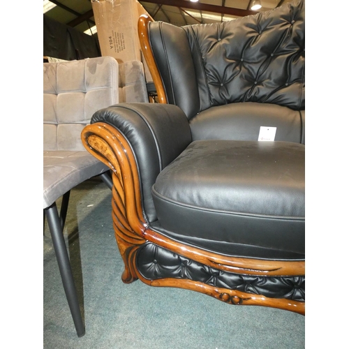 3206 - A darkwood framed/black upholstered three seater sofa (H107cm x W195 x D90cm) * this lot is subject ... 